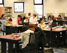 Photograph of children being tutored at the library