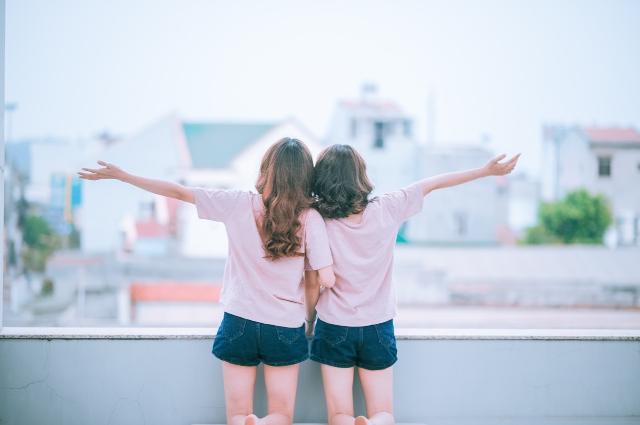 Photo of two girls holding hands