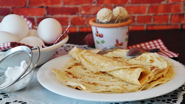 crêpes on a plate with baking supplies