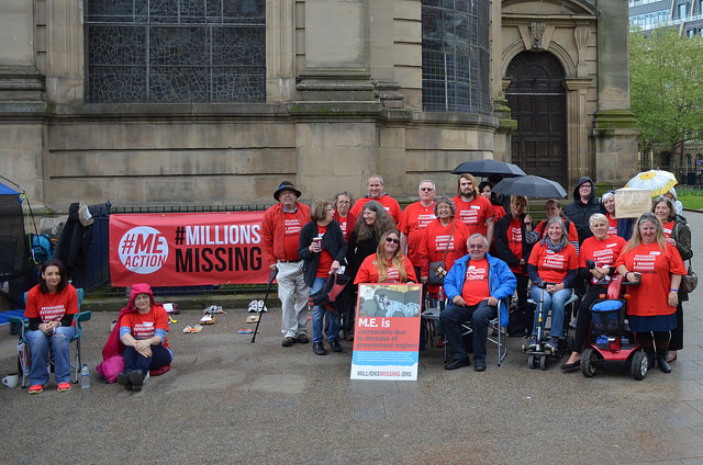 photo of people in the rain for awareness event