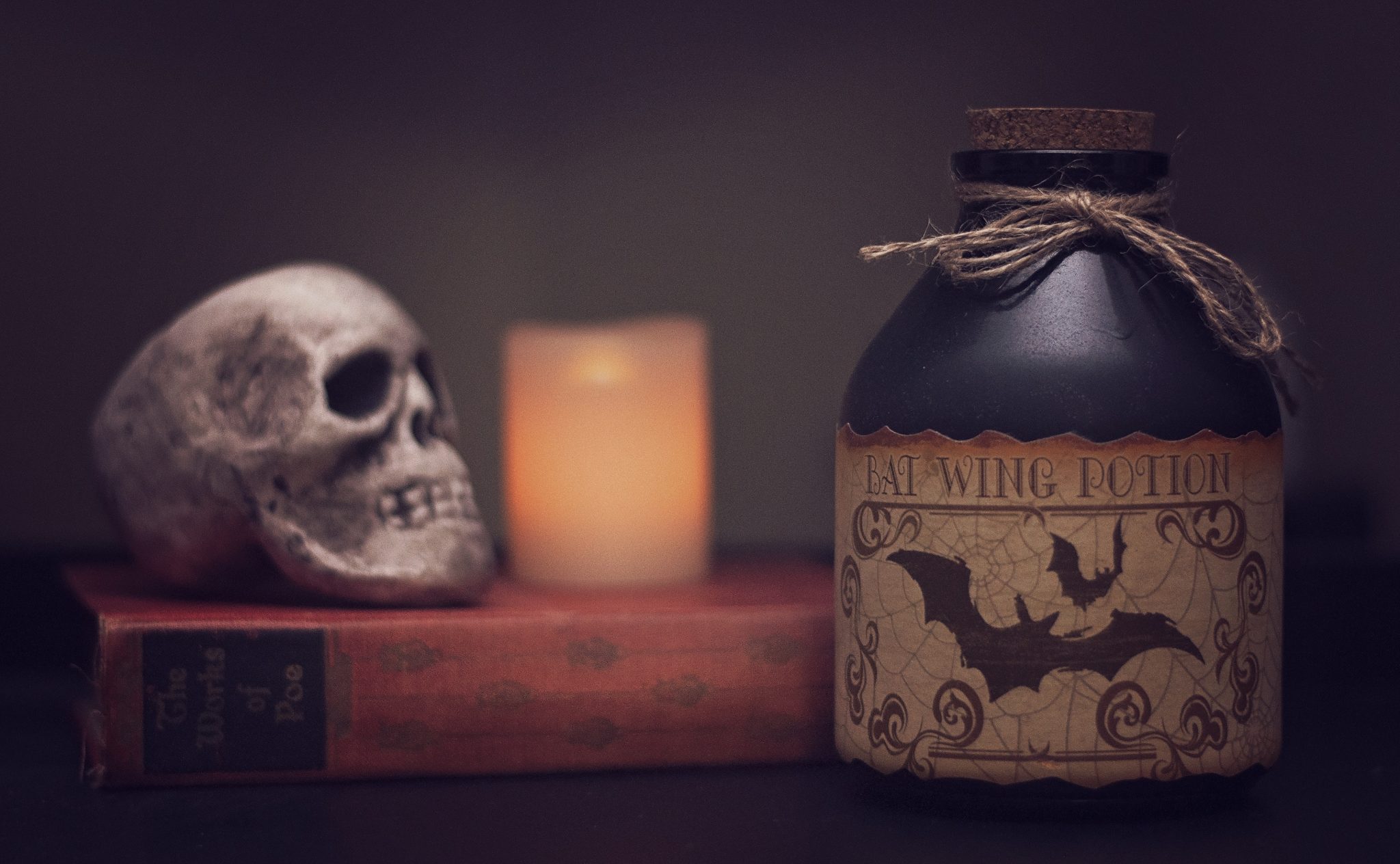 Book, skull, potion and candle