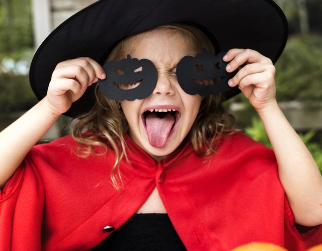 Child in witch costume