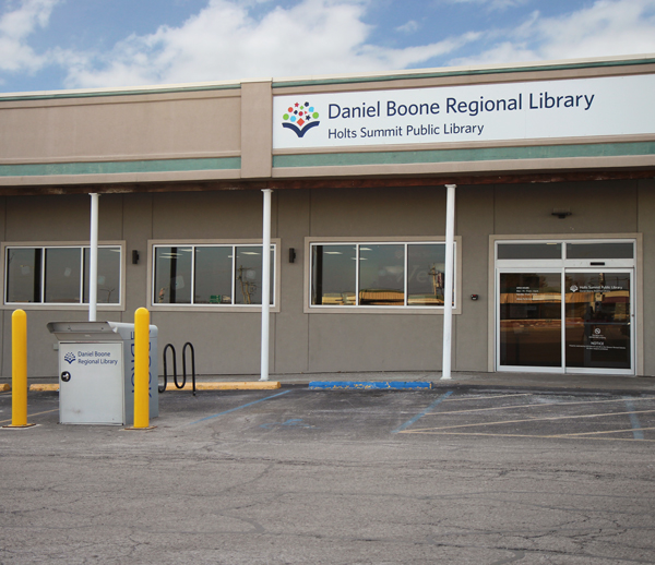 Holts Summit Public Library exterior with book drop, bike rack and accessible parking space in front