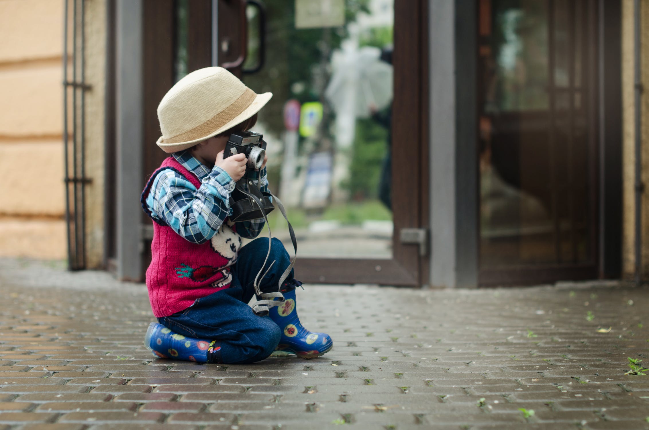 child taking photo