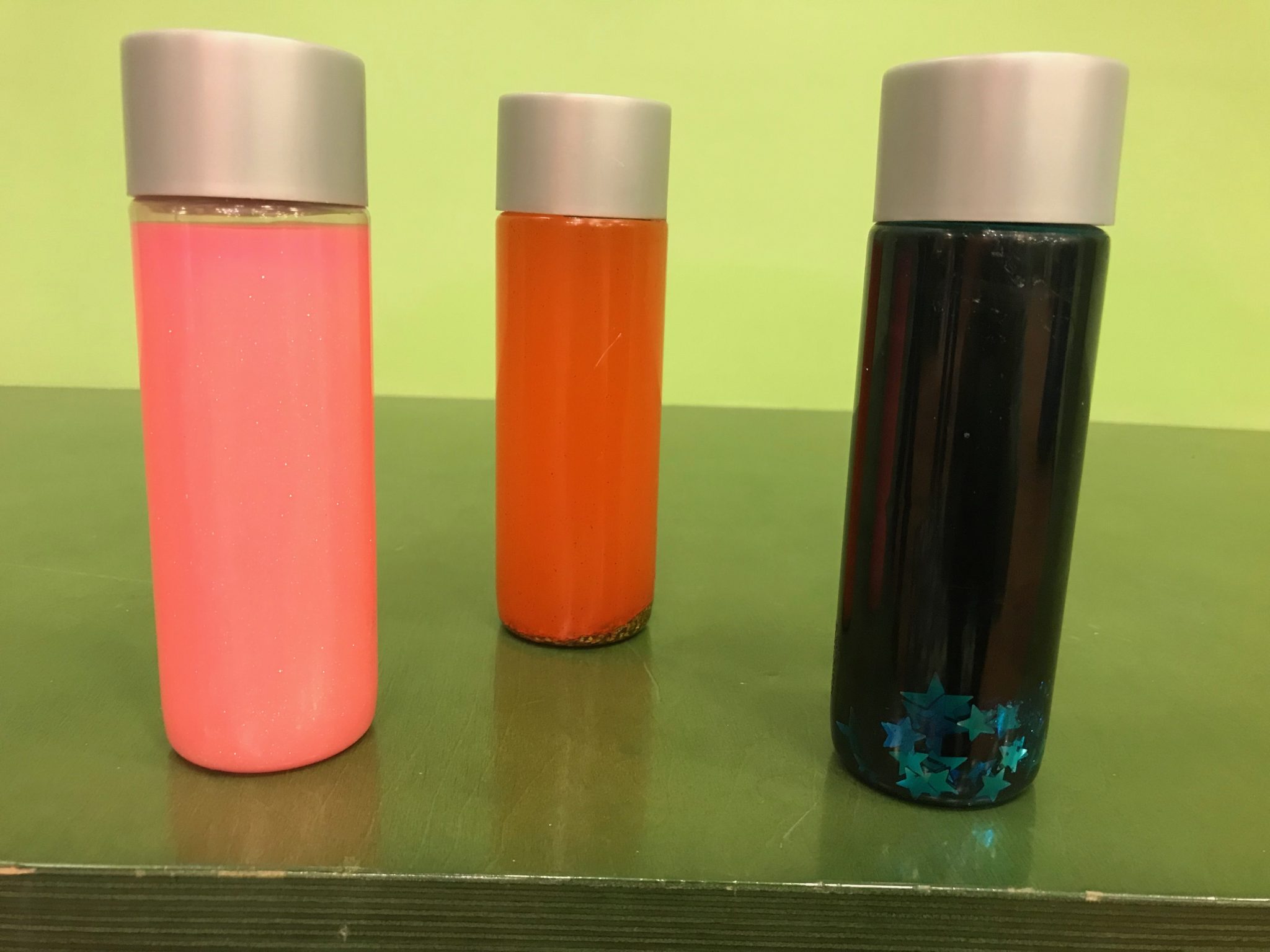 three calming sensory bottles