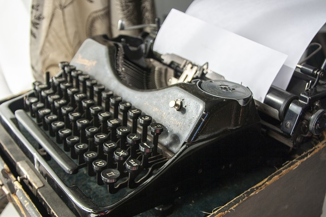 photo of typewriter with paper pulled through it