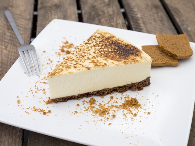 Slive of sugar pie on a plate sprinkled with brown sugar and fork