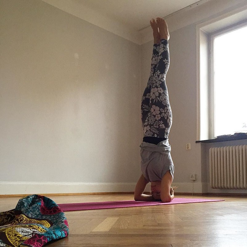 woman doing yoga in an empty room