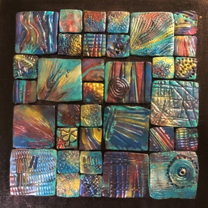 Polymer clay tiles on a black background