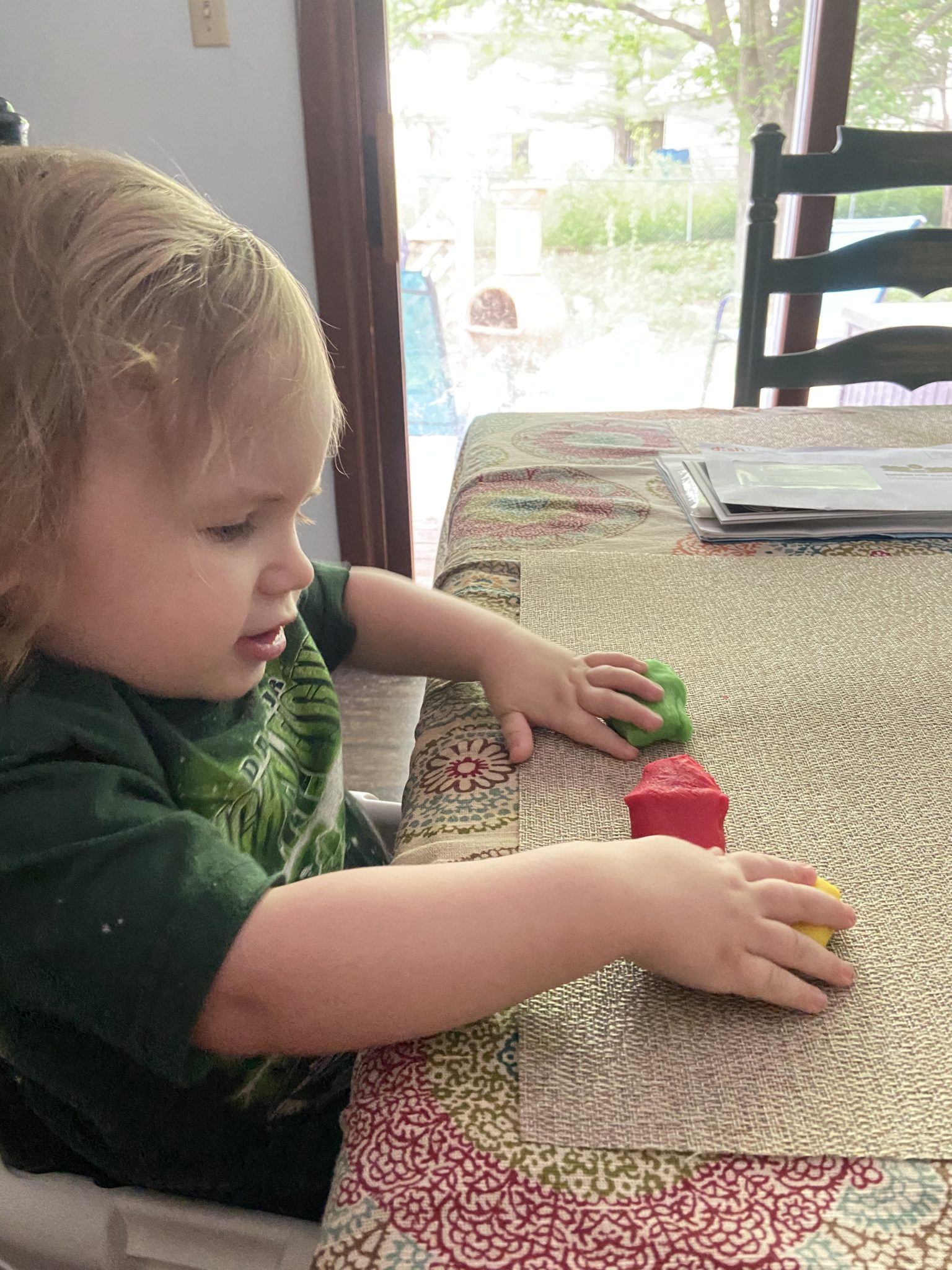 Child playing with play dough
