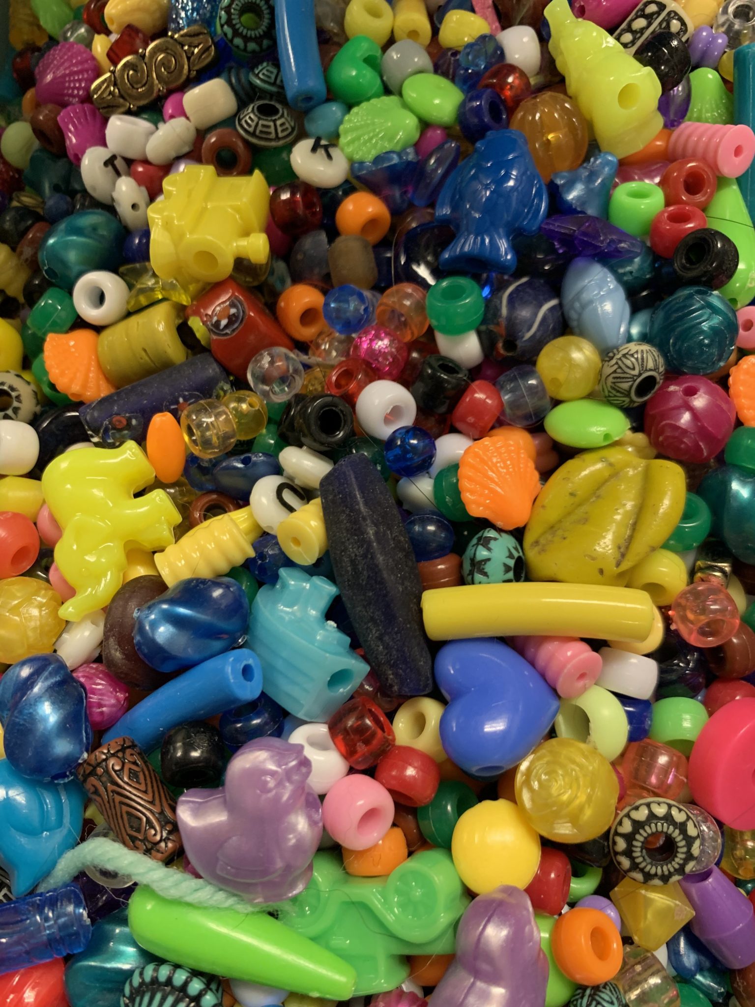 Picture of multicolored beads of varying sizes.