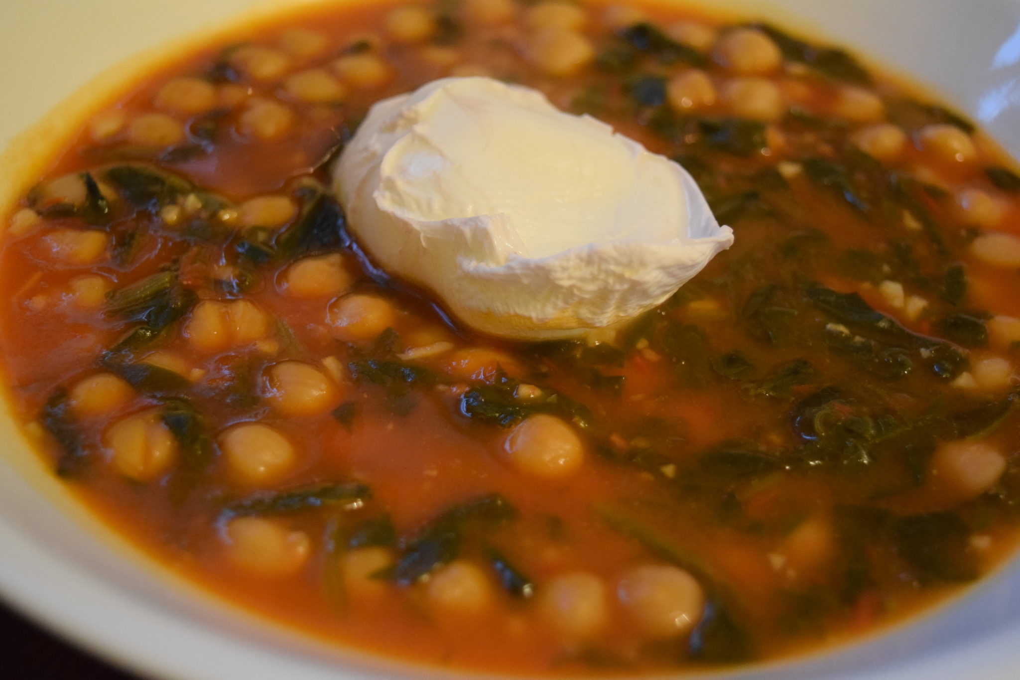 photo of chick pea stew with poached egg on top