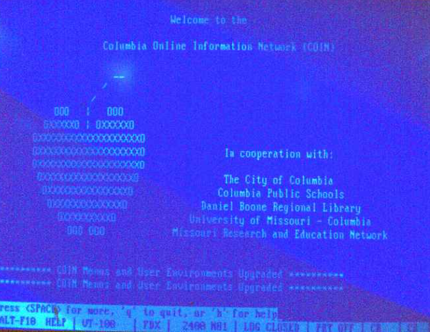 White text on blue DOS computer screen with ascii art of a whole apple and welcome message for "COIN" the Columbia Online Information Network