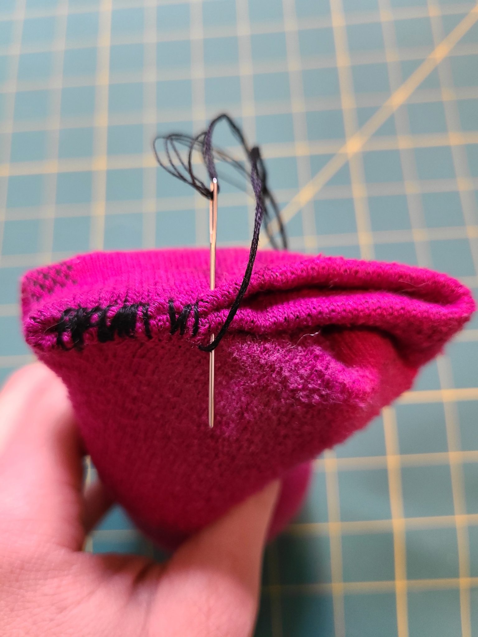Sewing sock closed.