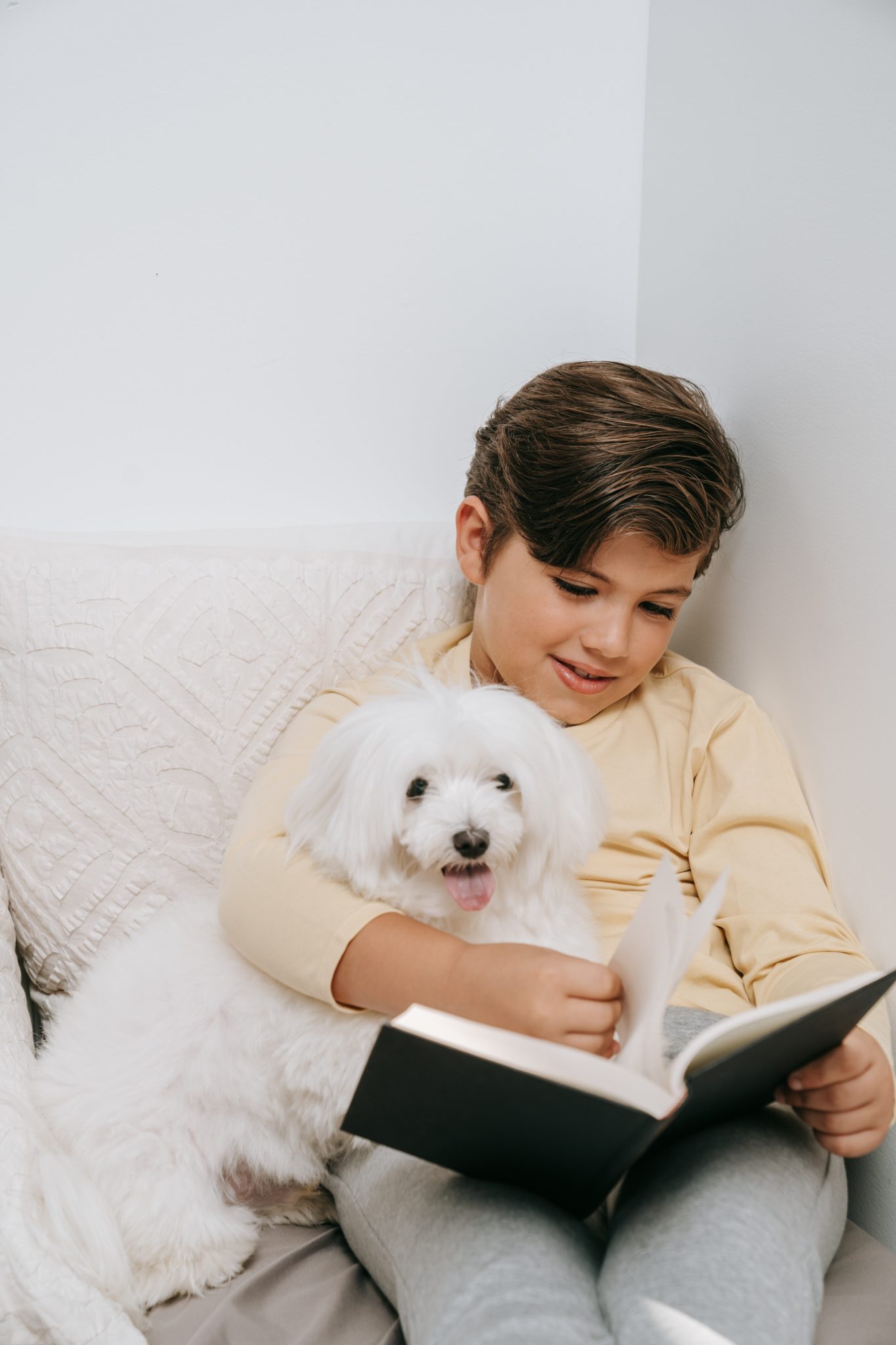 Child reading to their dog