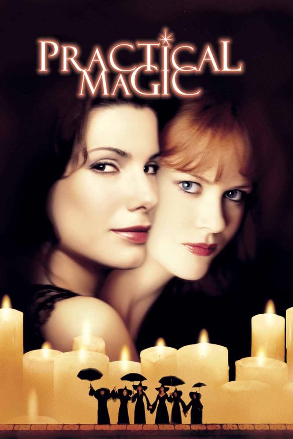 Movie poster for Practical Magic featuring the faces of actors Sandra Bullock and Nicole Kidman, who play Sally and Gillian Owens respectively. Below the two faces is a row of lit candles. Shrunk down in size and superimposed on top of the candles are four adult and two child witches dressed in black and holding umbrellas.