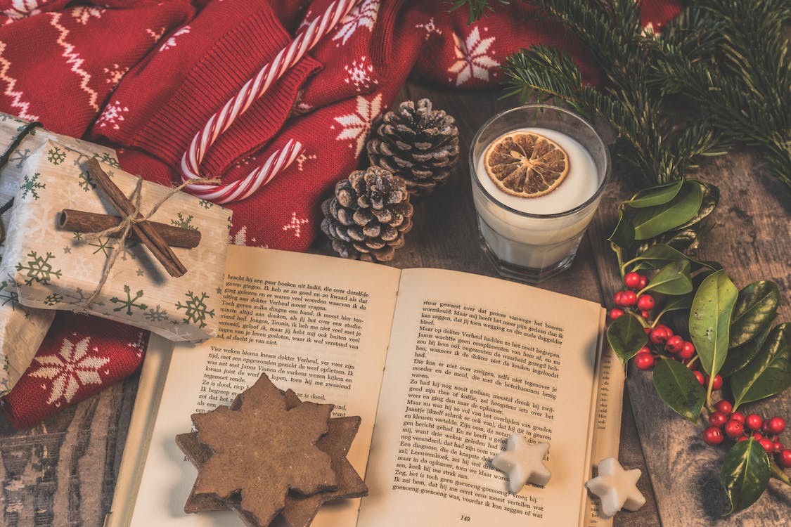 Photo of book with Christmas items around it