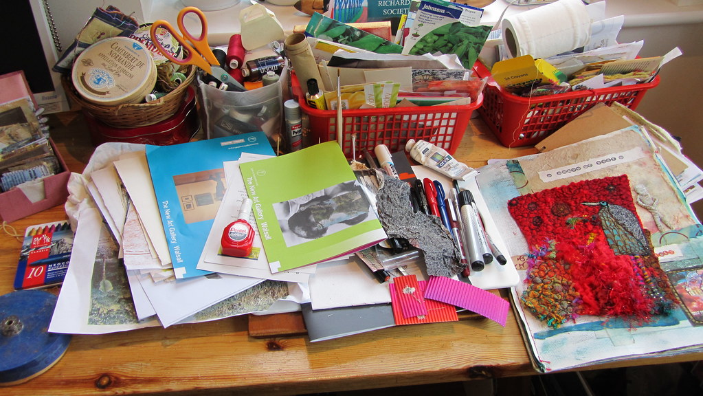 desk covered in crafting supplies