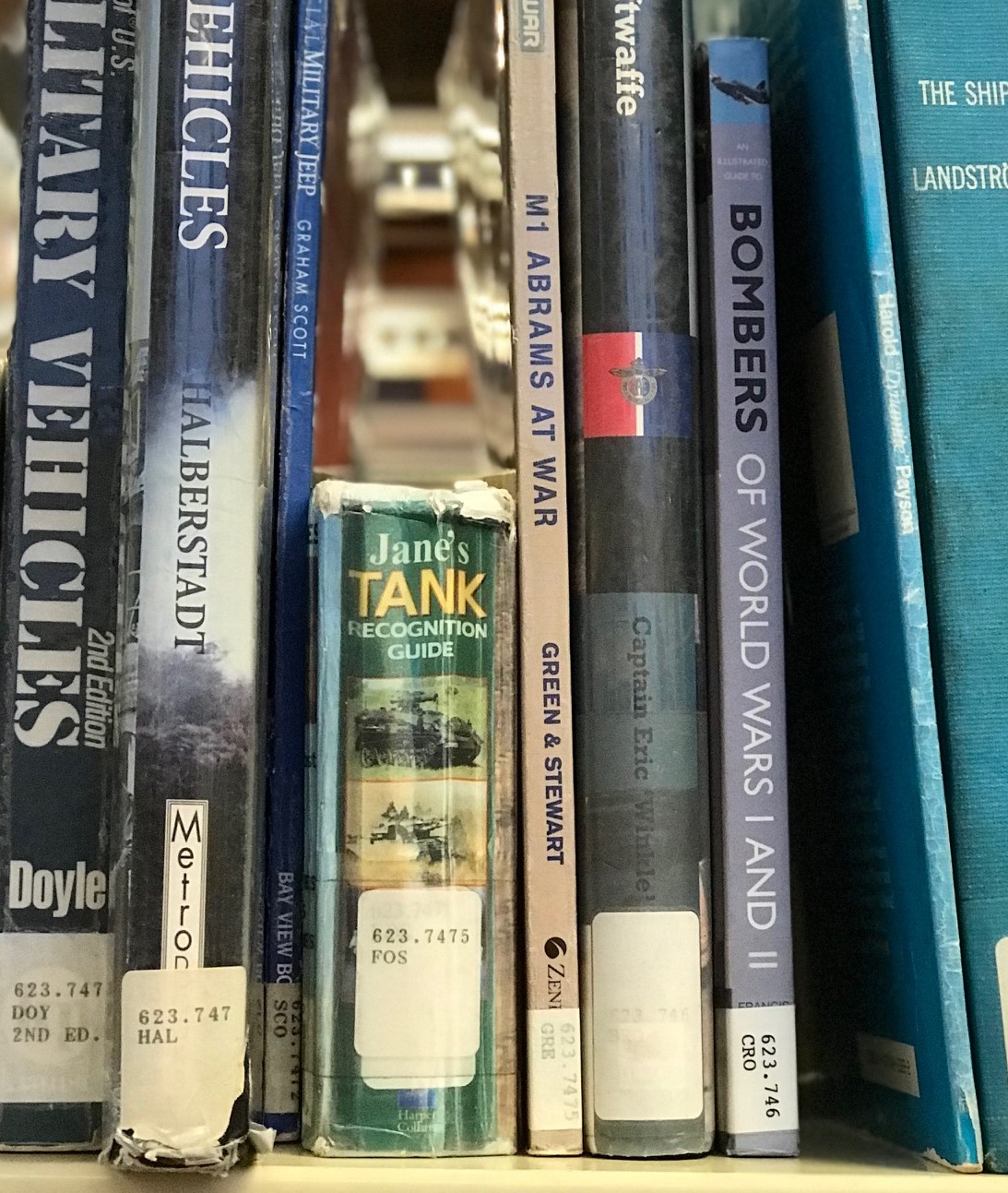 Jane's Tank Recognition Guide sits on a shelf between much larger books