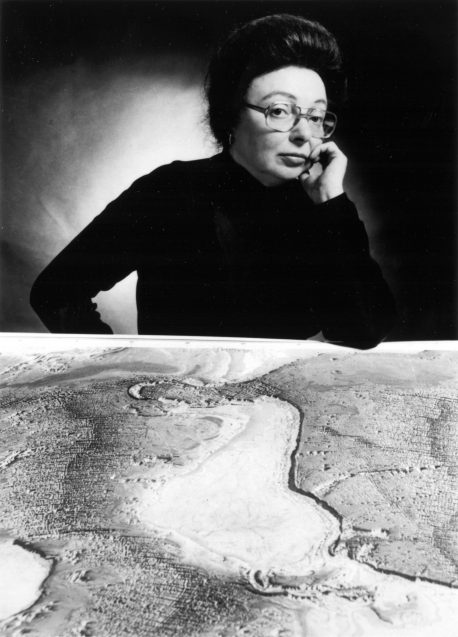 Mary Tharpe regards a model of the ocean floor