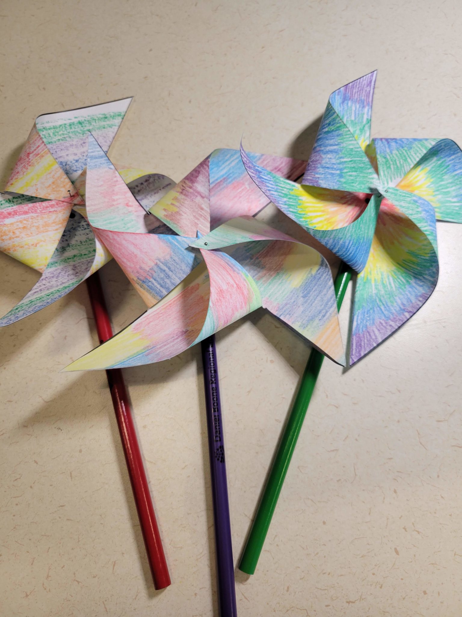 Three completed pinwheel flowers