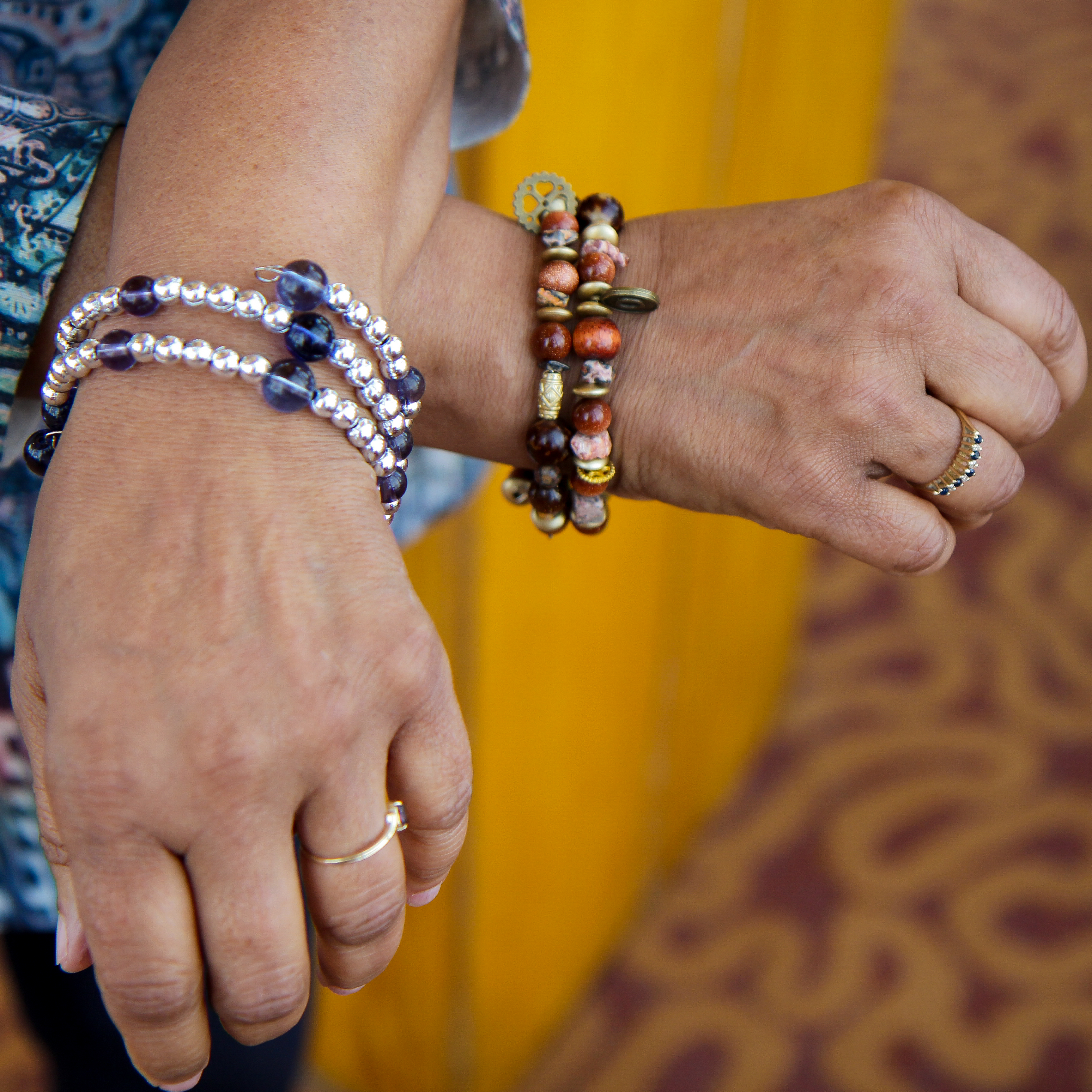 person modeling memory-wire bracelets