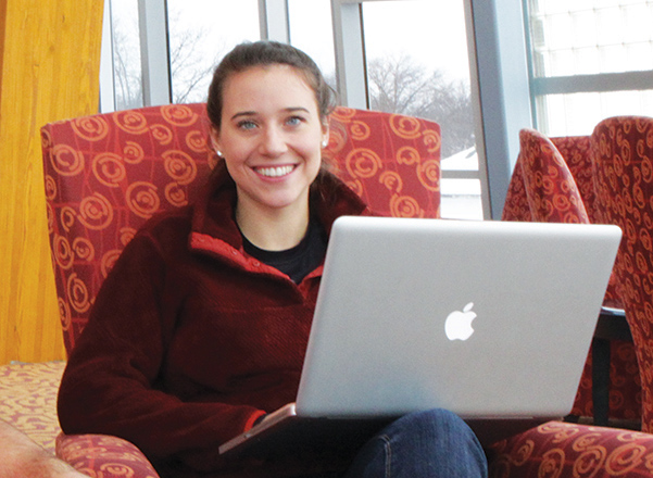 DBRL patron sitting with a laptop