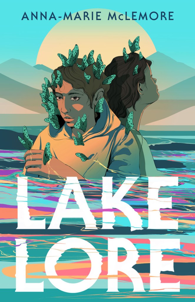 Cover of Anna-Marie McLemore's YA novel, Lakelore, featuring two brown-skinned teens submerged to their chests in a multicolored lake. The teens wear tan shirts and have lots of green spotted butterflies perched on their heads, faces and shoulders.
