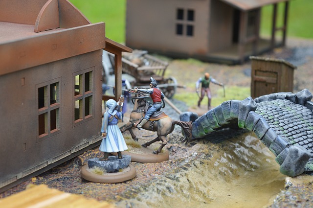 A number of miniatures arranged on a piece of fake terrain for a role-playing game session.