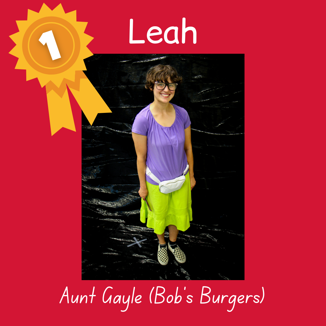 1st place Leah as Aunt Gayle from Bob's Burgers. Photo of an adult wearing a purple shirt, white fanny pack and green skirt and glasses.