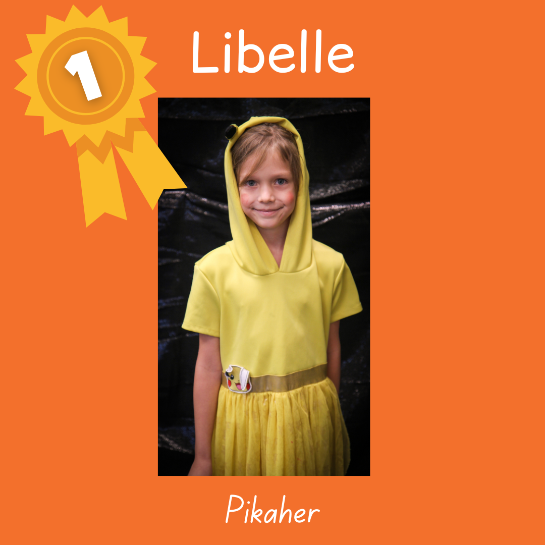 1st place Libelle as Pikaher. Photo of a child in a yellow hooded dress with Pikachu ears.