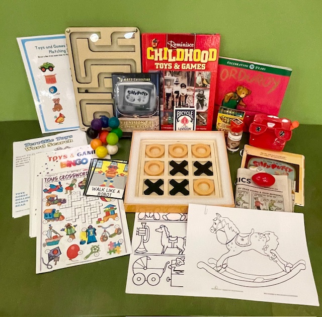 A variety of puzzles, toys, and games, including a wooden Tick-Tac-Toe game and a marble maze.
