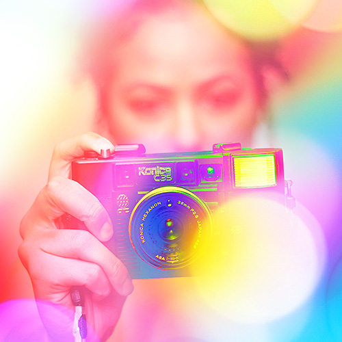 a person holds up a camera