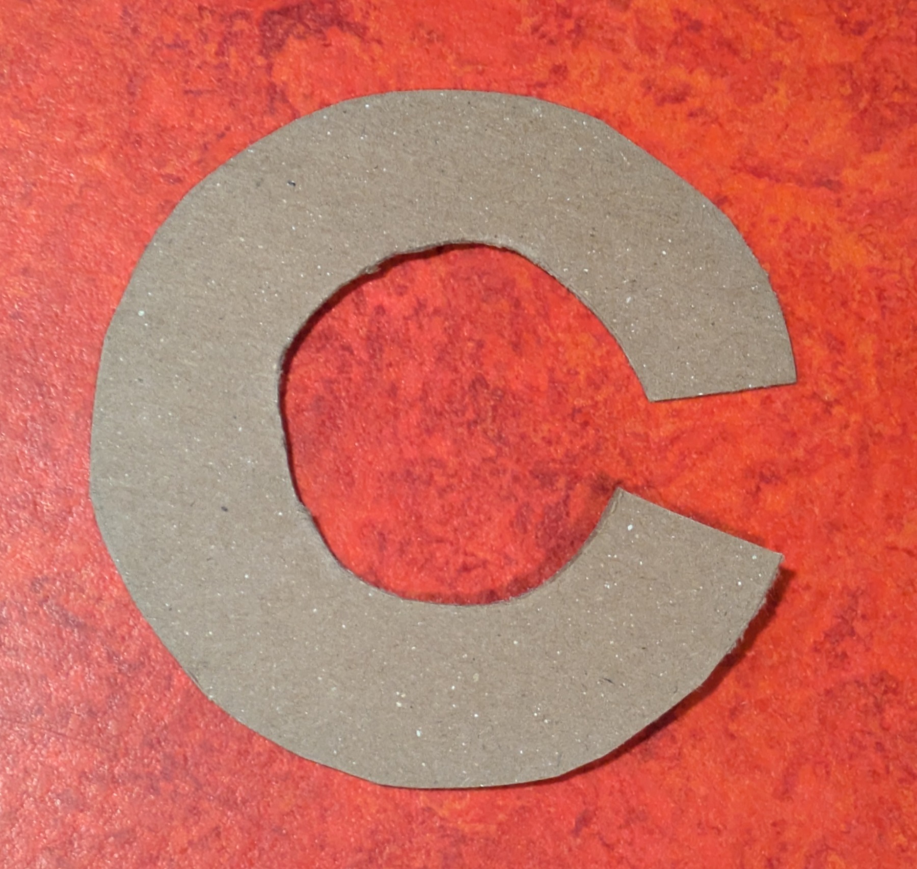 Cardboard circle cut into 'c' shape