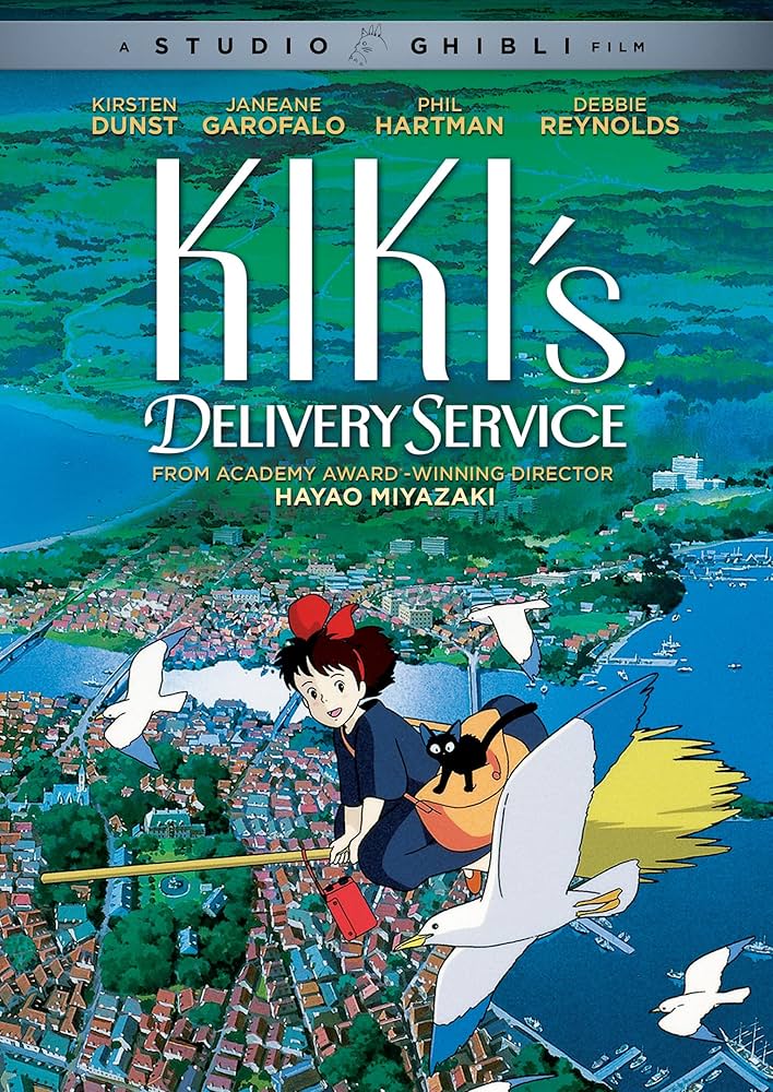 Cover of the dvd case for the movie Kiki's Delivery Service, featuring Kiki a white skinned witch in a black dress with shoulder-length brown hair tied half-up by a big red bow. Kiki is flying on a broom and has an orange satchel bag over her shoulder. On top of the bag is a small black cat, Jiji. Kiki and Jiji fly up high over a coastal town. 