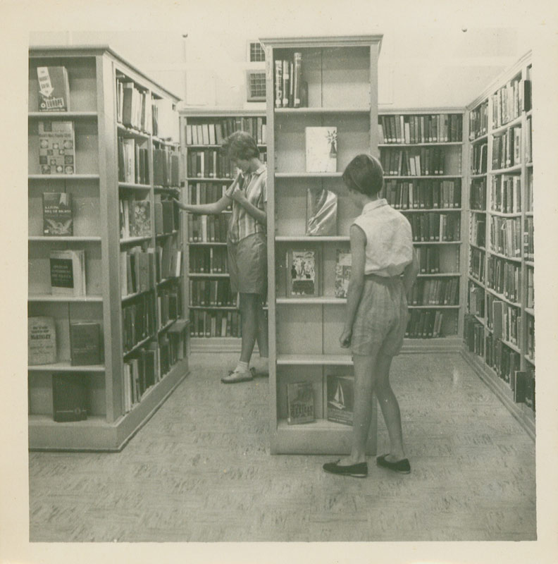 People browse bookshelves at the Callaway County Public Library, 1961