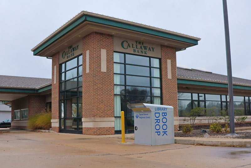 A Callaway Bank building with a library book drop in the foreground
